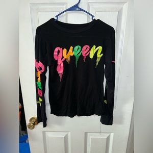 Women’s black long sleeve tee with queen drip print in neon on shirt and sleeve